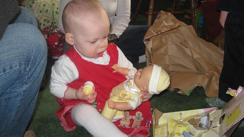 IMG_3944.JPG - Eve got a new baby doll.  It talks and coos and made noise long before she even unwrapped the present :)