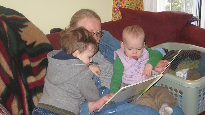 IMG_4007.JPG - Lex was very torn between stories with Mema and trains with Joyce.