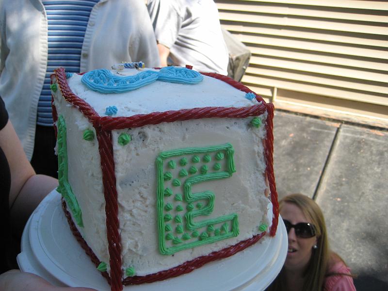 1010061814.JPG - There is my lovely cake.  It says Happy Birthday one one side, L E X on the other three sides, and 3 on top.  Chocolate, buttercream frosting, twizzlers, 4 layers, oh so yummy!